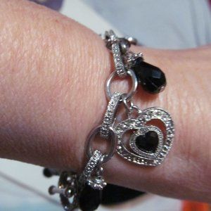 Silver tone rhinestone hearts charm bracelet